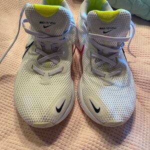 Nike Renew women’s White Athletic Sneakers with Neon Yellow Accent